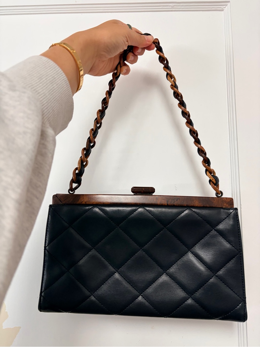 CHANEL Black Quilted Leather Shoulder Bag with Brown Chain